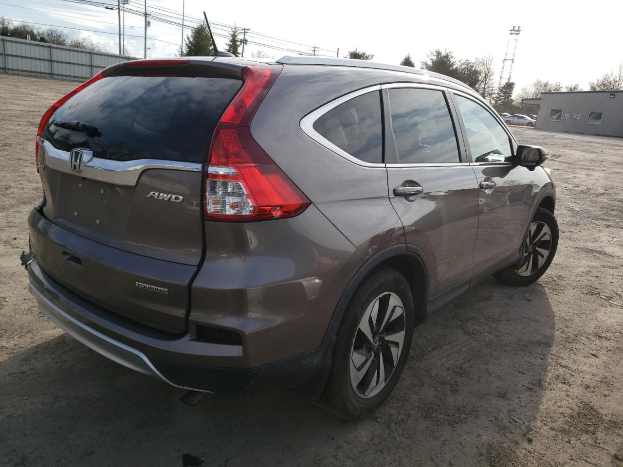 Photo 4 from auction – 2015 HONDA CR-V TOURI with VIN 5J6RM4H94FL040511