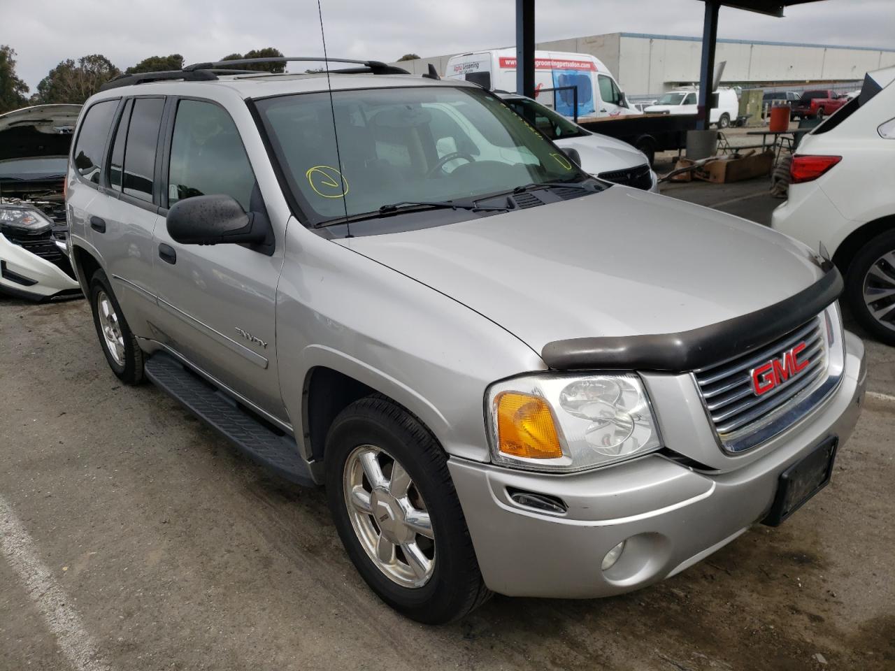 GMC ENVOY 2006 with VIN 1GKDT13SX62165275 - Photo from auction