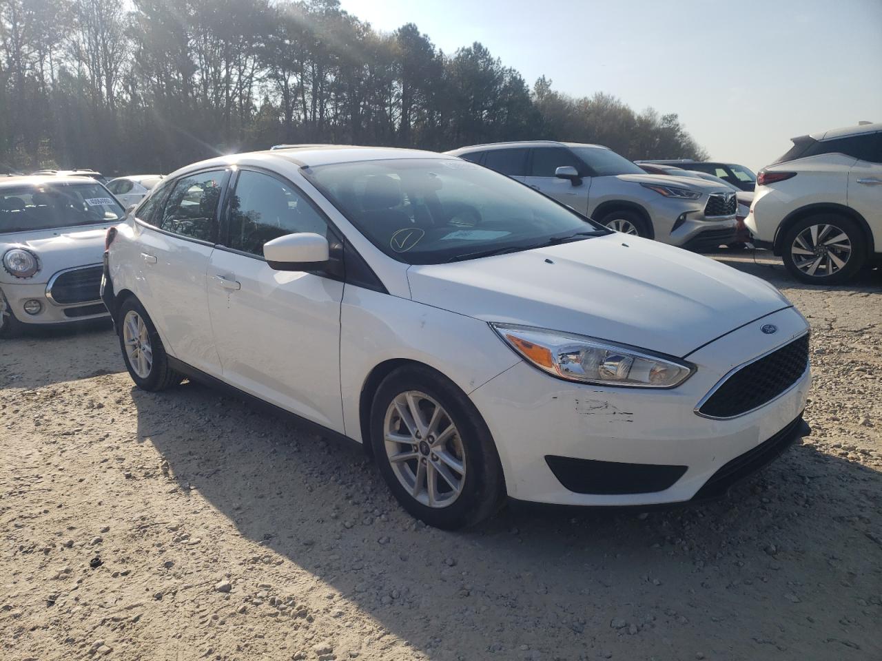 FORD FOCUS SE 2018 with VIN 1FADP3F24JL218312 - Photo from auction