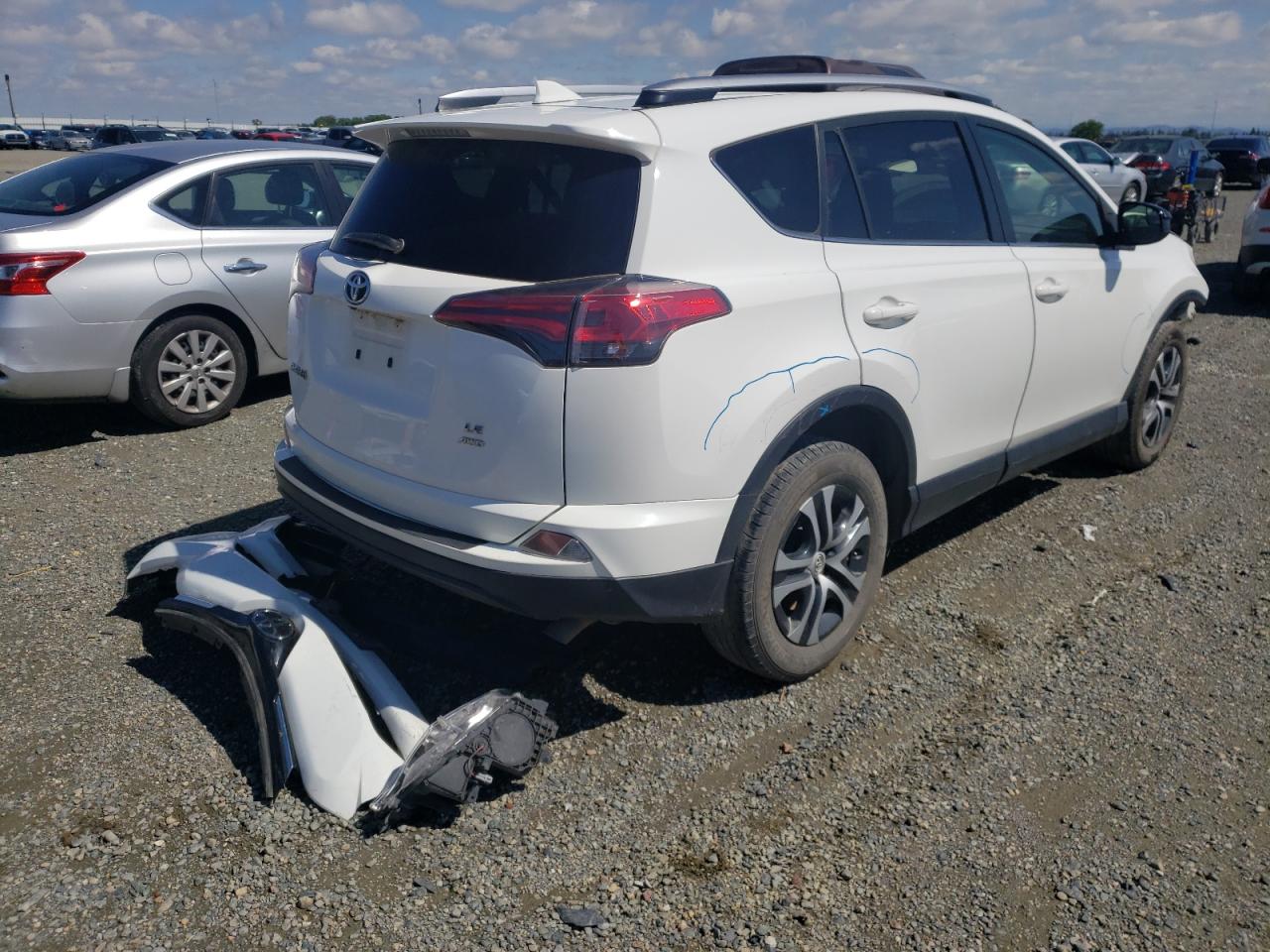 Photo 4 from auction – 2018 TOYOTA RAV4 LE with VIN JTMBFREV2JJ203791