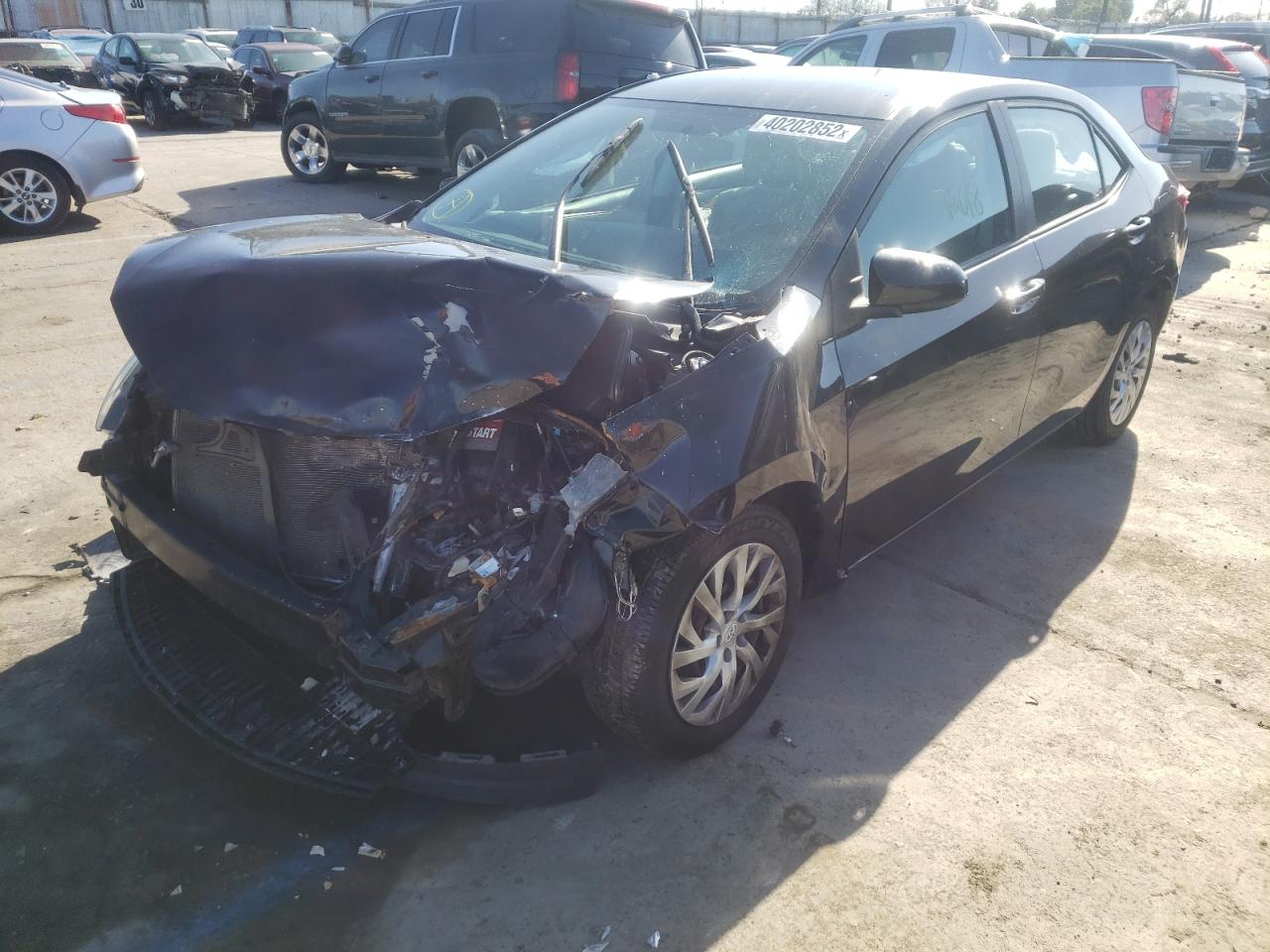Photo 2 from auction – 2016 TOYOTA COROLLA L with VIN 5YFBURHE8GP517645