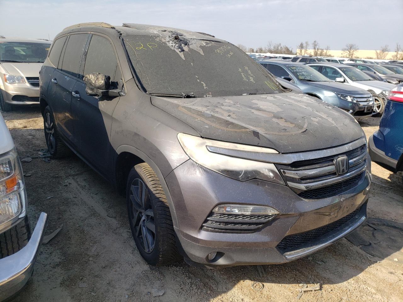 HONDA PILOT TOUR 2017 with VIN 5FNYF6H96HB031984 - Photo from auction