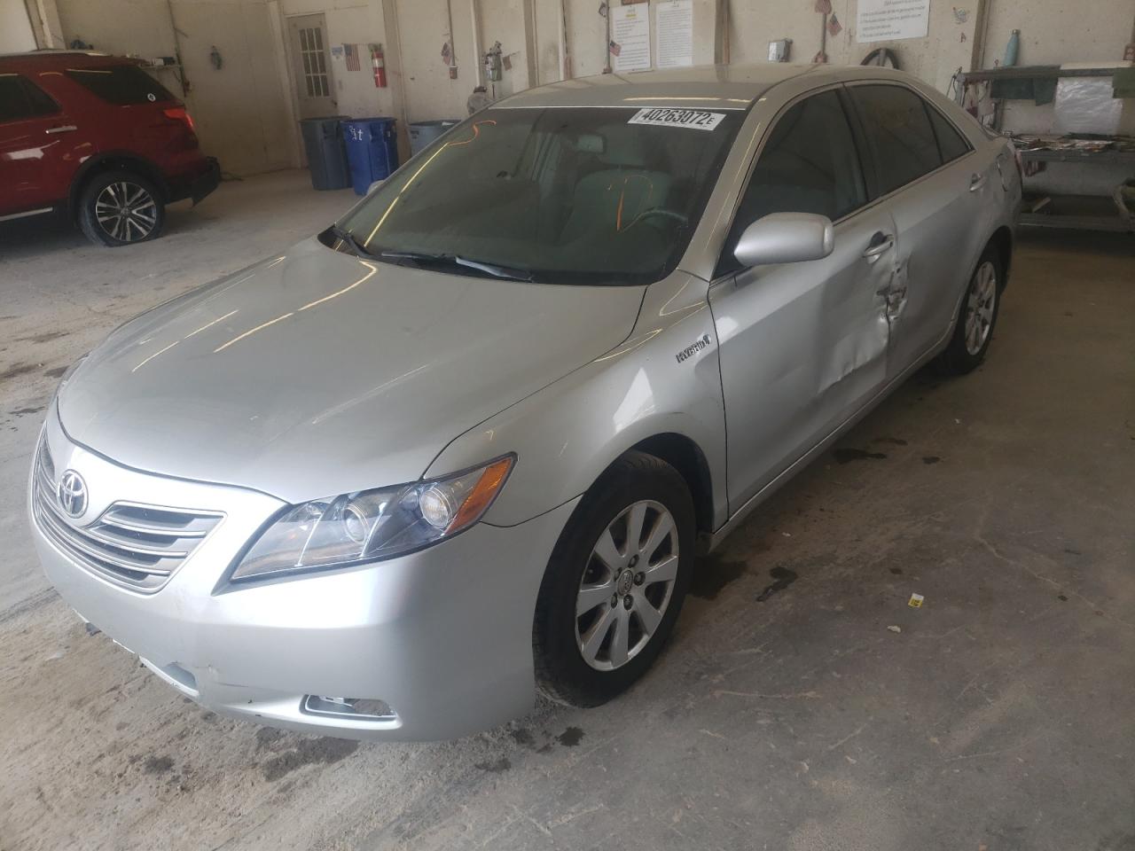 Photo 2 from auction – 2007 TOYOTA CAMRY HYBR with VIN JTNBB46K873029964