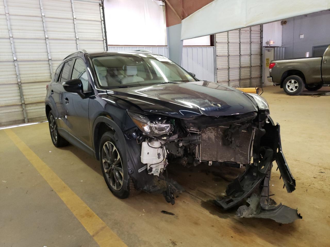MAZDA CX-5 GT 2016 with VIN JM3KE4DYXG0707125 - Photo from auction