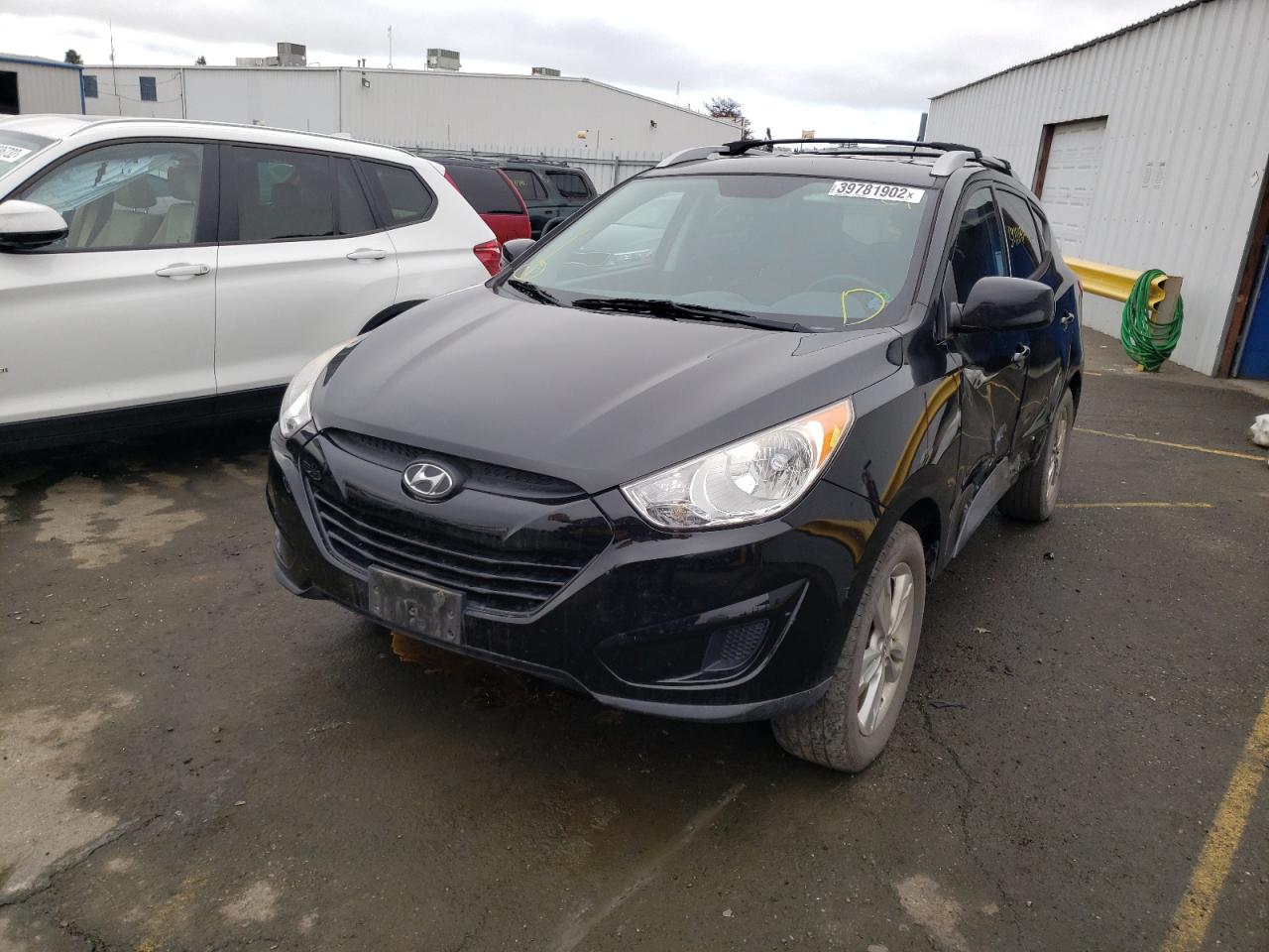 Photo 2 from auction – 2011 HYUNDAI TUCSON GLS with VIN KM8JUCACXBU309565