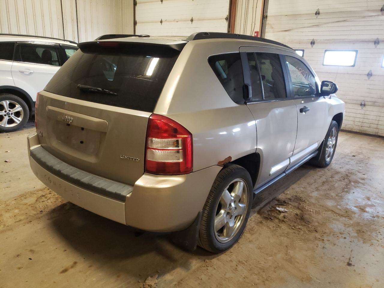 Photo 4 from auction – 2009 JEEP COMPASS LI with VIN 1J4FT57B79D173892