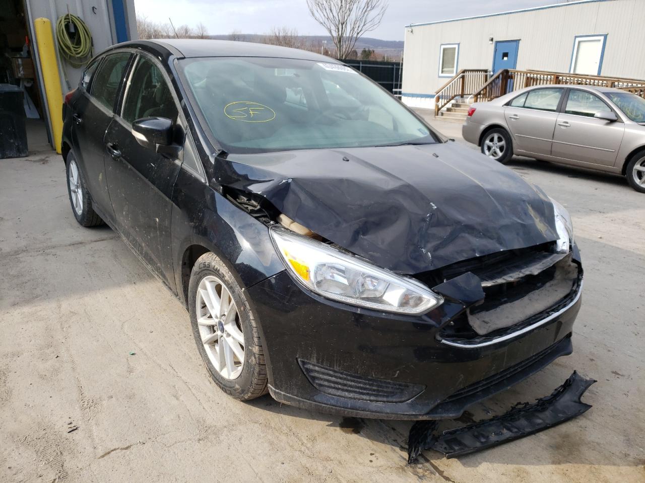 FORD FOCUS SE 2017 with VIN 1FADP3K23HL215689 - Photo from auction