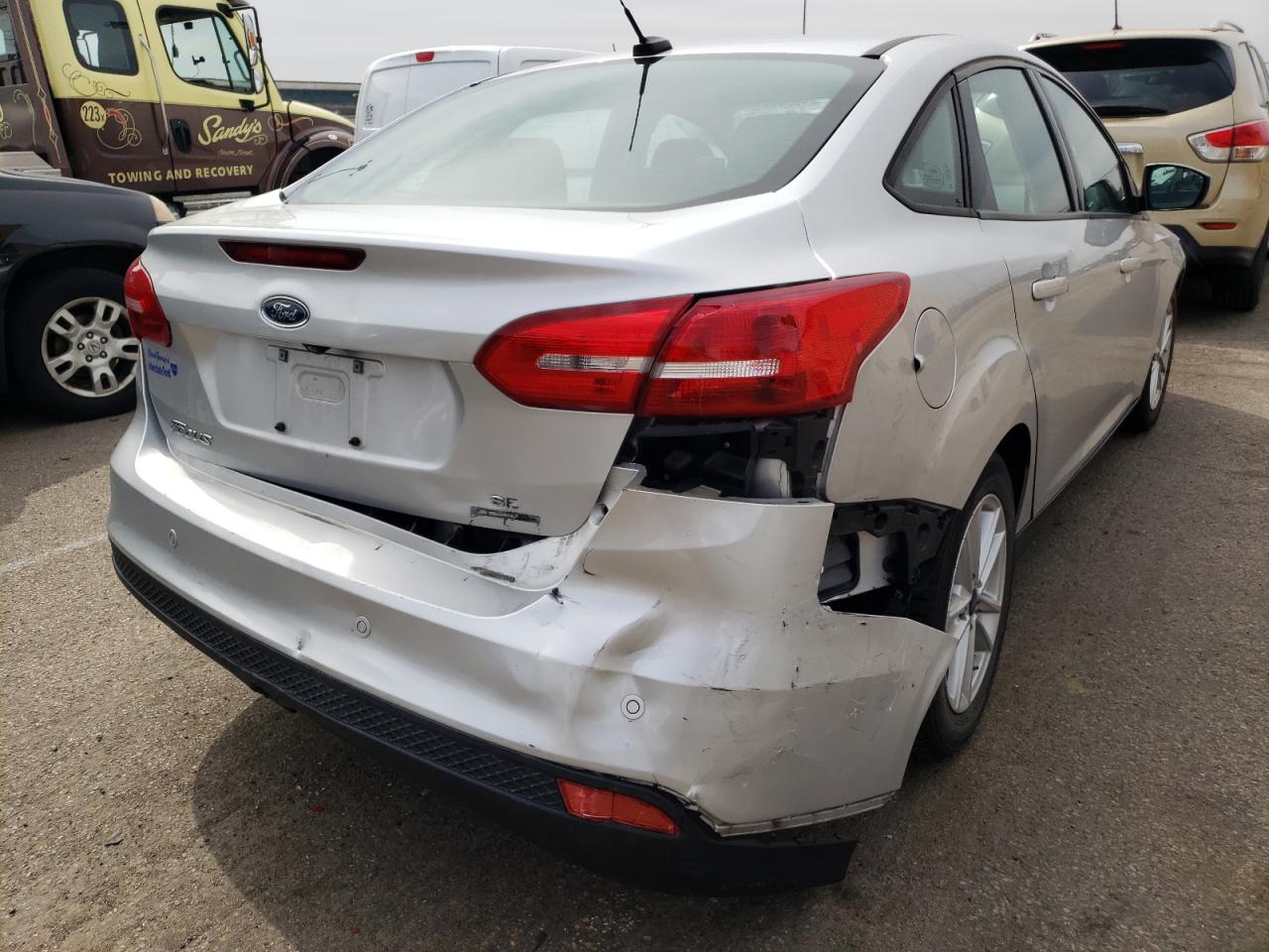 Photo 9 from auction – 2016 FORD FOCUS SE with VIN 1FADP3F21GL305402
