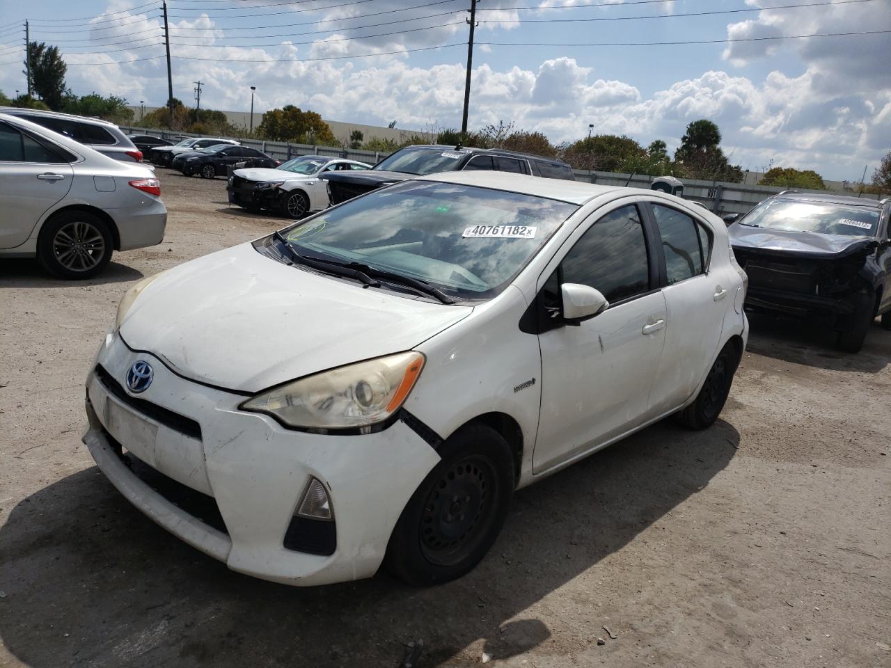 Photo 2 from auction – 2014 TOYOTA PRIUS C with VIN JTDKDTB35E1558014