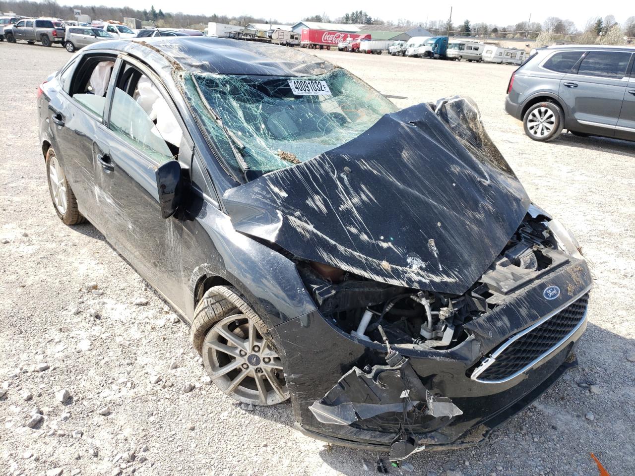 FORD FOCUS SE 2016 with VIN 1FADP3F2XGL390532 - Photo from auction