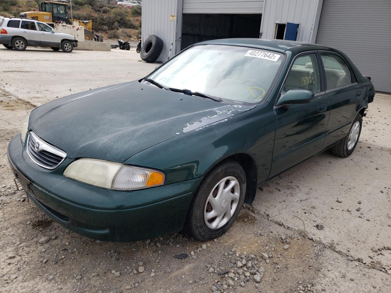 Photo 2 from auction – 1999 MAZDA 626 ES with VIN 1YVGF22C5X5851413