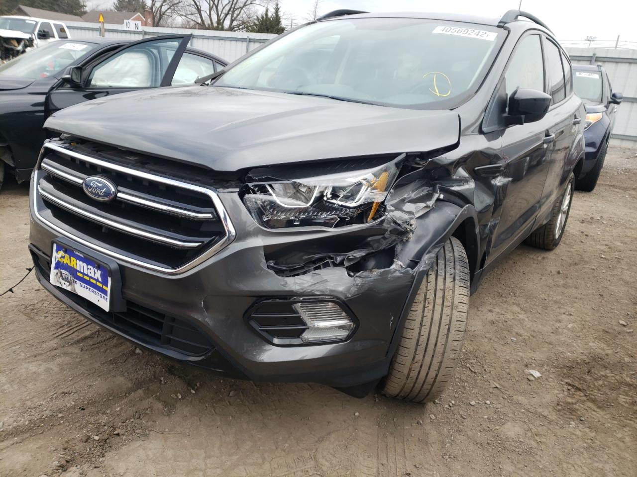 Photo 2 from auction – 2017 FORD ESCAPE SE with VIN 1FMCU9GD3HUC06220