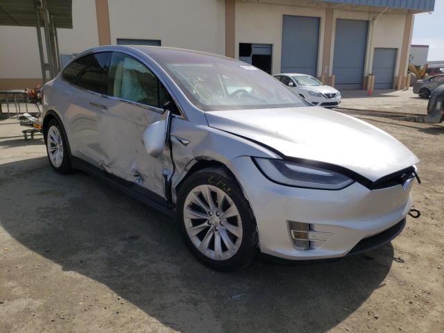 TESLA MODEL X 2017 with VIN 5YJXCDE2XHF052384 - Photo from auction