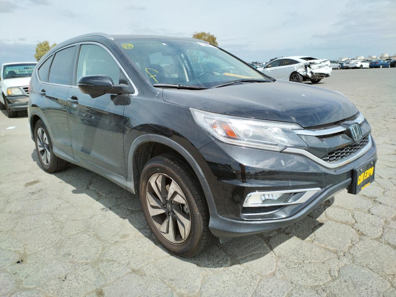 Photo 1 from auction – 2015 HONDA CR-V TOURI with VIN 5J6RM4H92FL093322