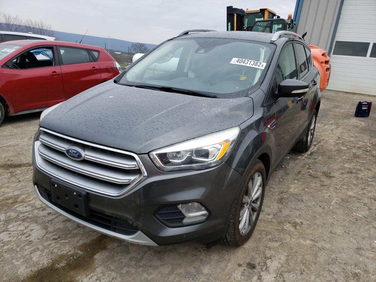 Photo 2 from auction – 2017 FORD ESCAPE TIT with VIN 1FMCU9J98HUD90686