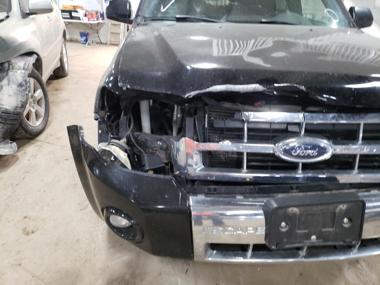 Photo 10 from auction – 2010 FORD ESCAPE LIM with VIN 1FMCU0E75AKA33200