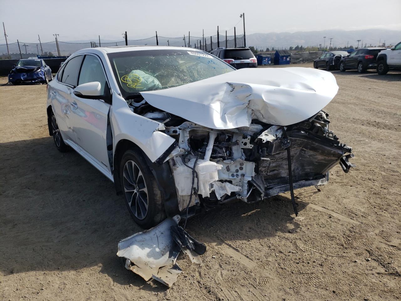TOYOTA AVALON HYB 2016 with VIN 4T1BD1EB9GU048673 - Photo from auction