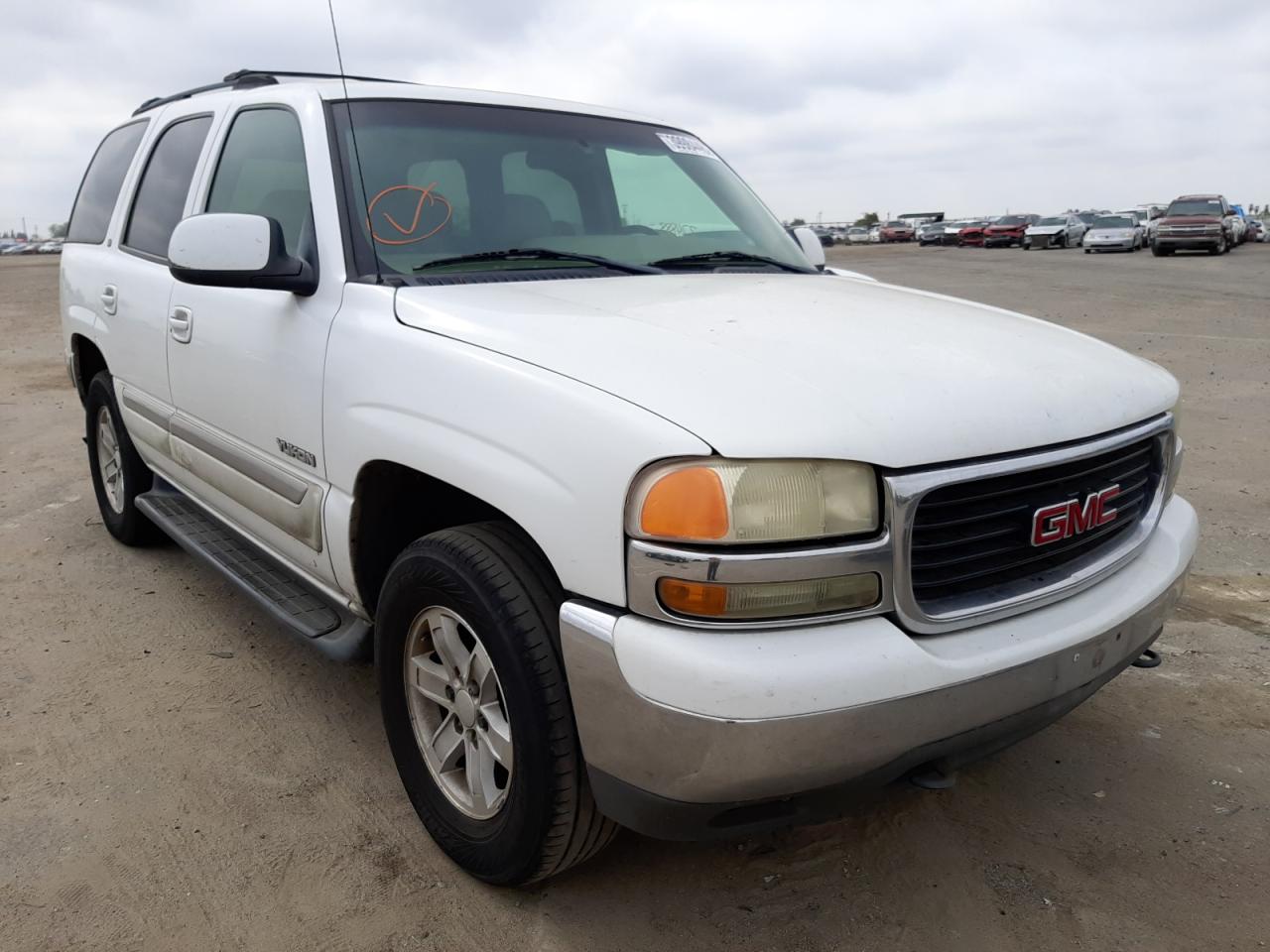 GMC YUKON 2001 with VIN 1GKEC13TX1R170652 - Photo from auction