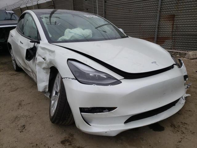 TESLA MODEL 3 2022 with VIN 5YJ3E1EB2NF143569 - Photo from auction