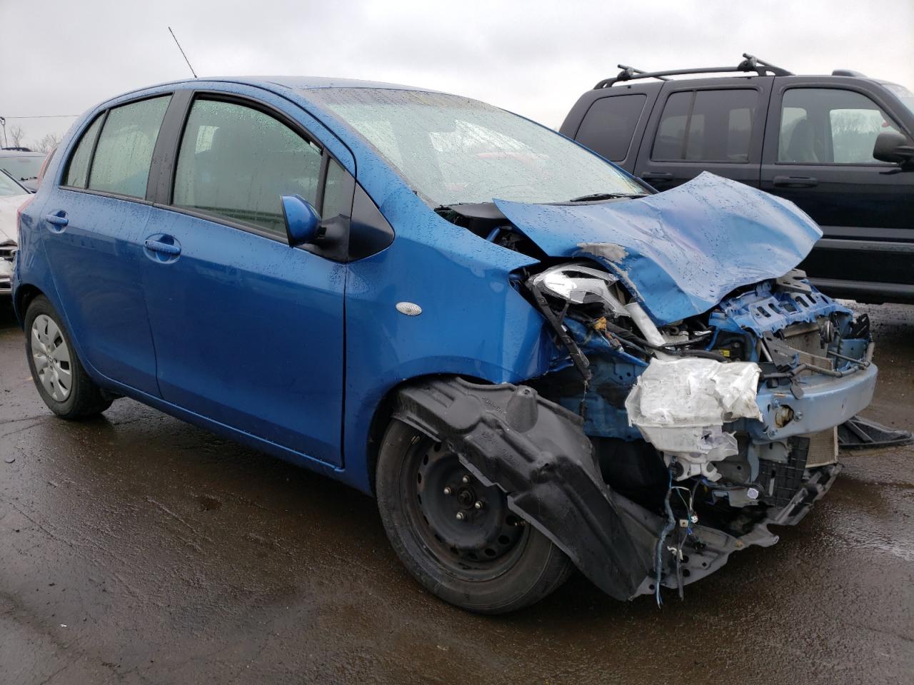 TOYOTA YARIS 2011 with VIN JTDKT4K35B5330592 - Photo from auction