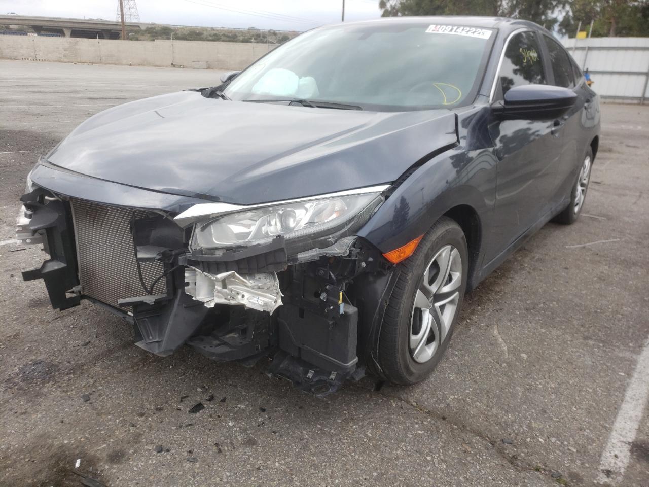 Photo 2 from auction – 2018 HONDA CIVIC LX with VIN 2HGFC2F55JH573121
