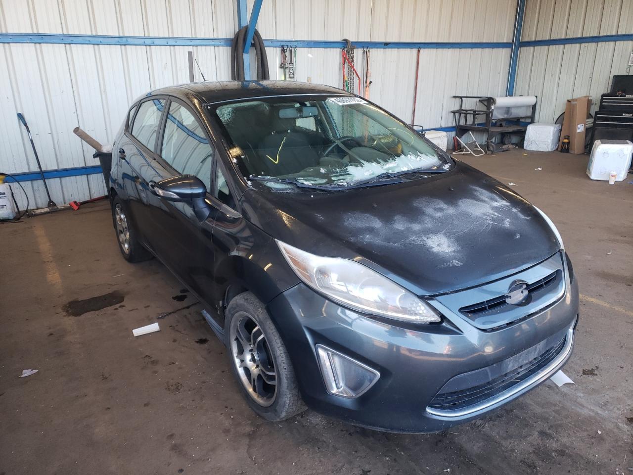 FORD FIESTA SES 2011 with VIN 3FADP4FJ1BM233699 - Photo from auction