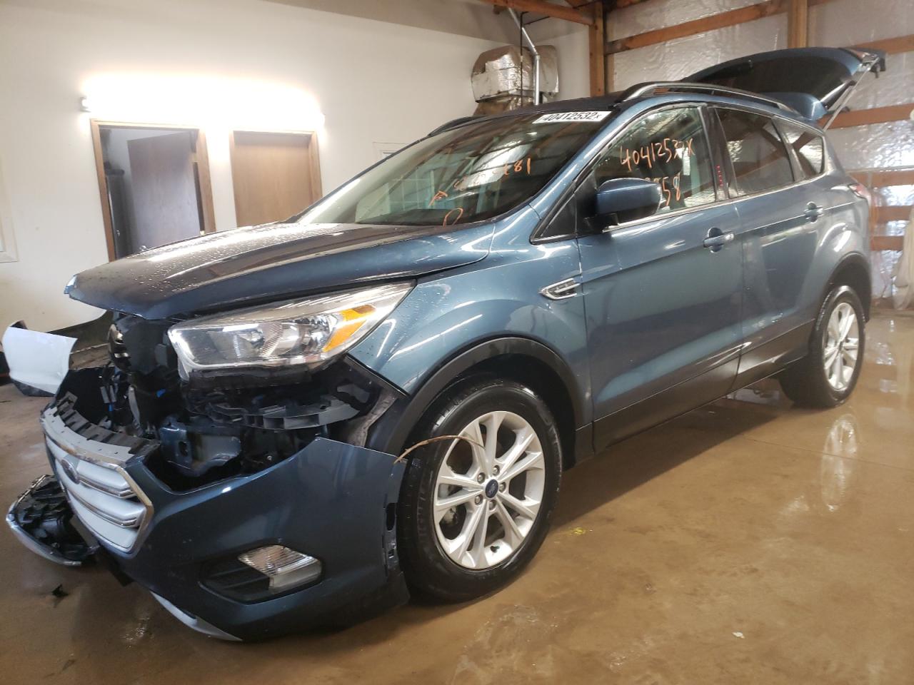 Photo 2 from auction – 2018 FORD ESCAPE SE with VIN 1FMCU0GD0JUA80481