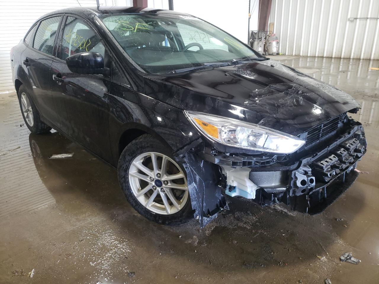 FORD FOCUS SE 2018 with VIN 1FADP3FE5JL267383 - Photo from auction
