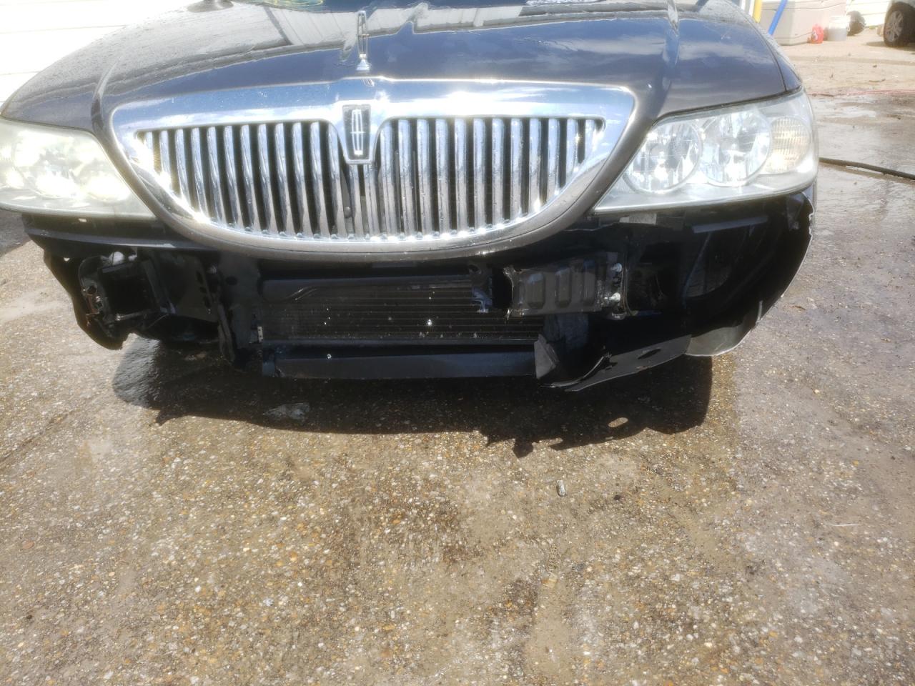 Photo 9 from auction – 2004 LINCOLN TOWN CAR E with VIN 1LNHM81W74Y649211