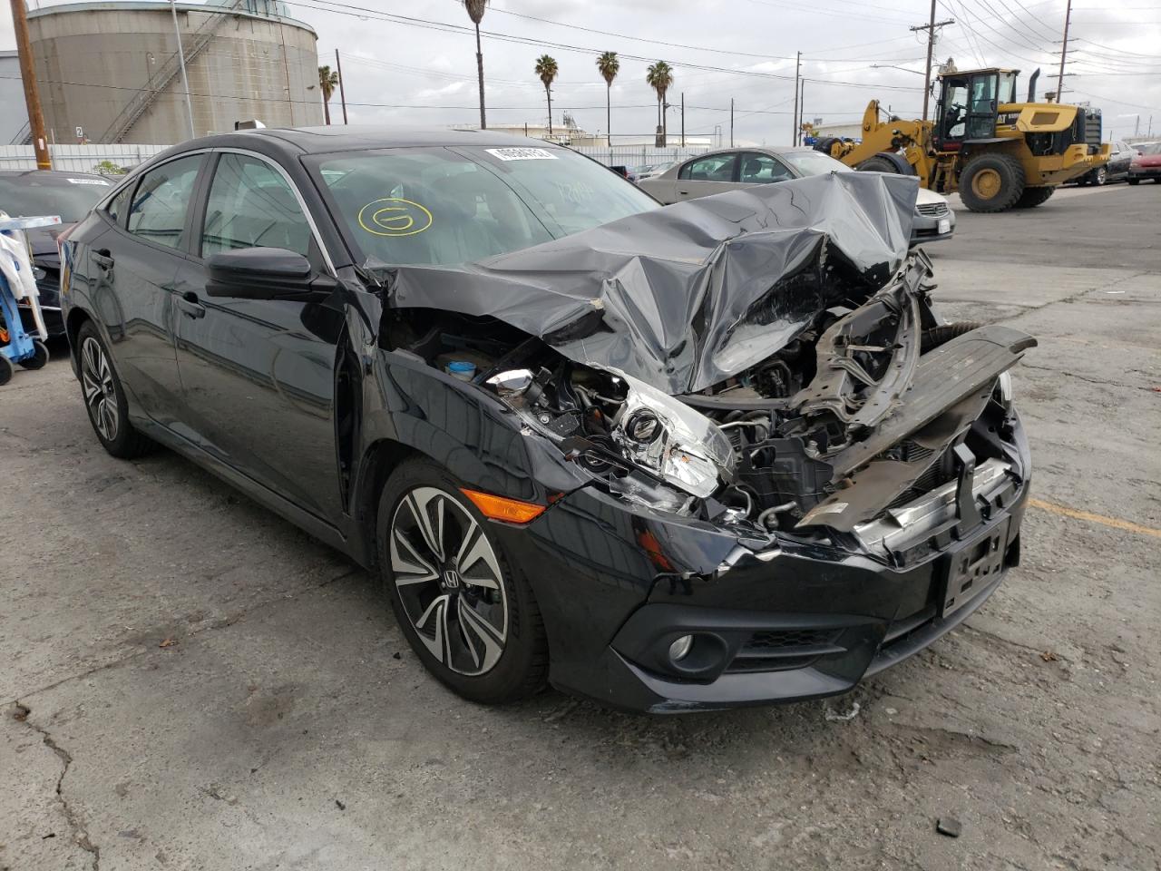 HONDA CIVIC EXL 2016 with VIN 2HGFC1F71GH656081 - Photo from auction