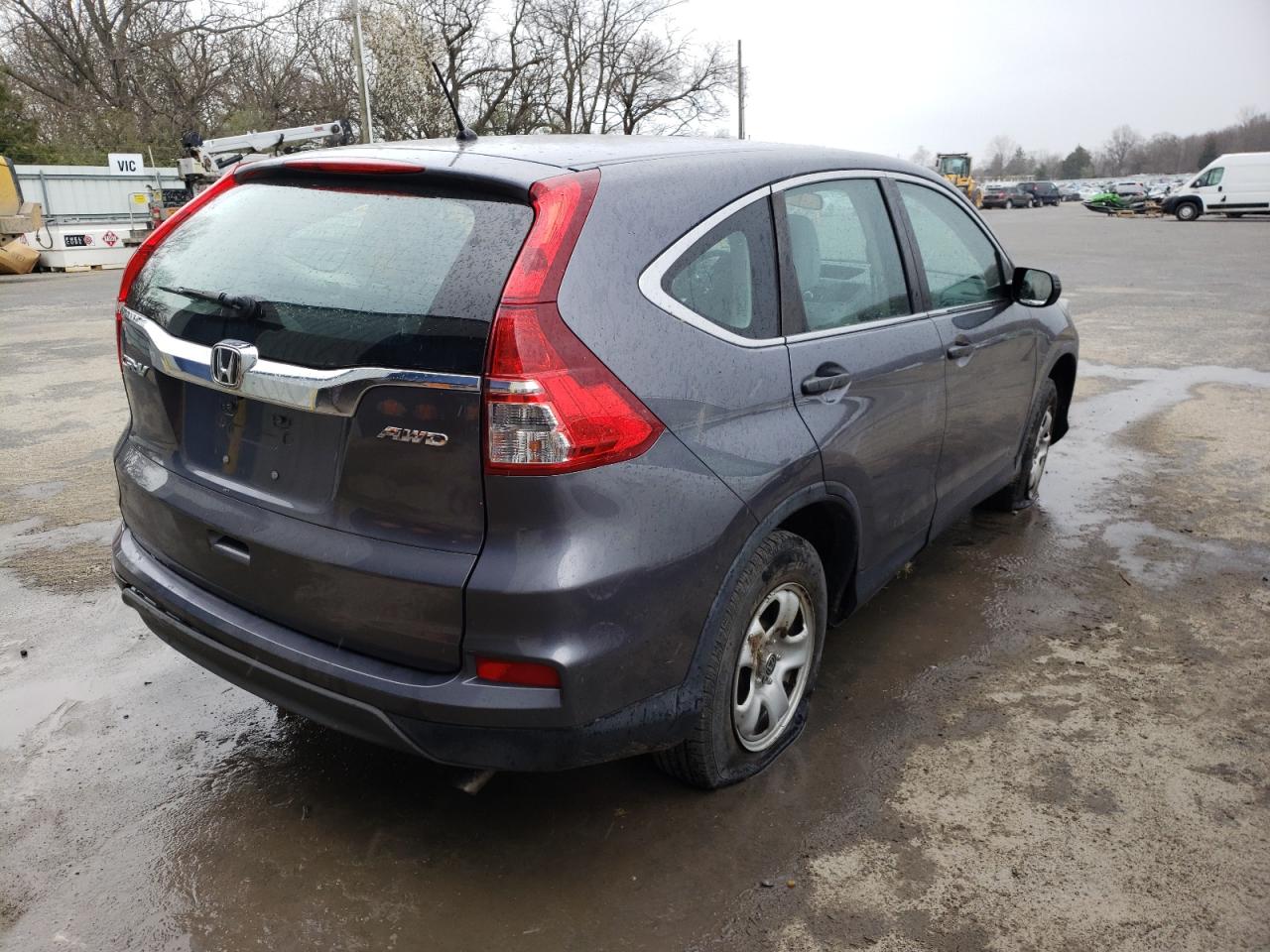 Photo 4 from auction – 2016 HONDA CR-V LX with VIN 5J6RM4H31GL121852