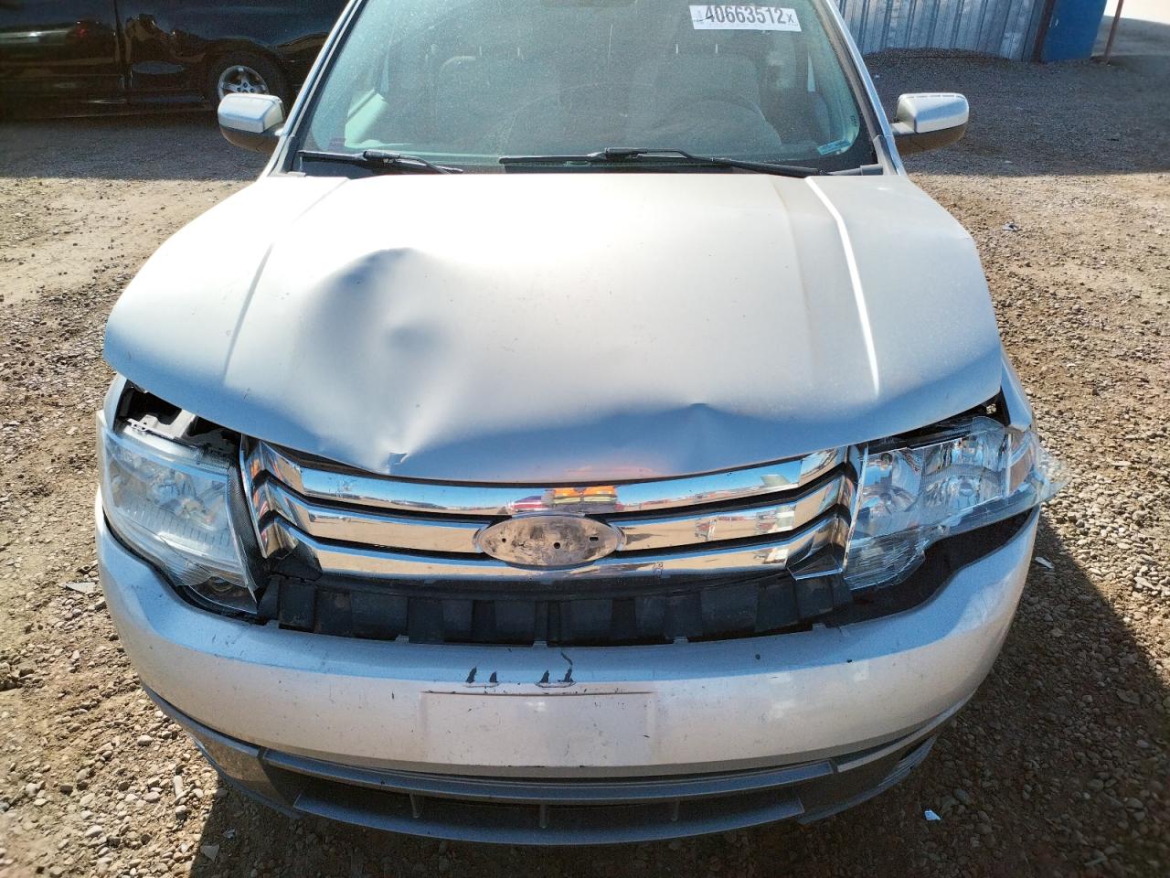 Photo 7 from auction – 2008 FORD TAURUS X S with VIN 1FMDK02W68GA35959