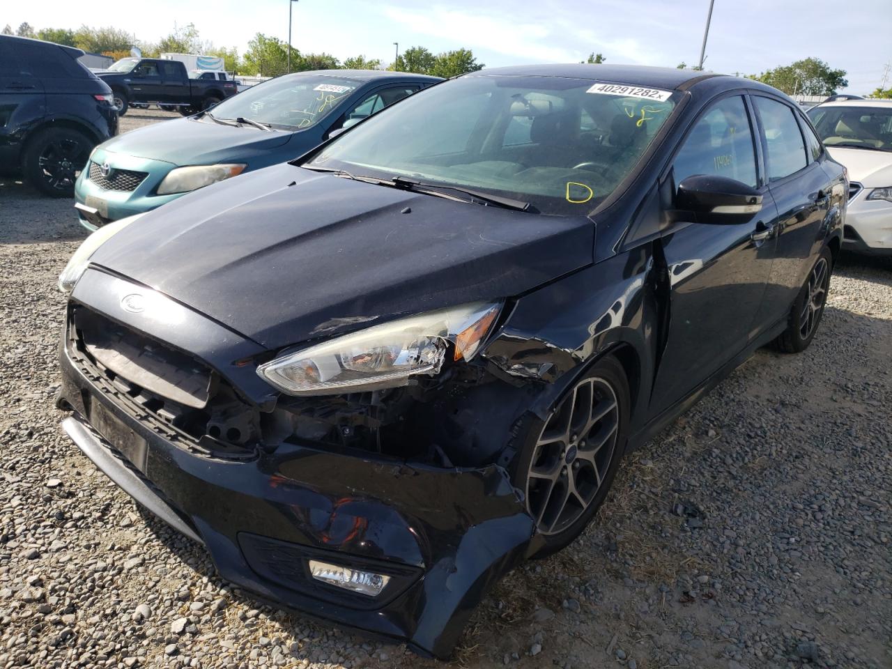 Photo 2 from auction – 2015 FORD FOCUS SE with VIN 1FADP3F22FL275387