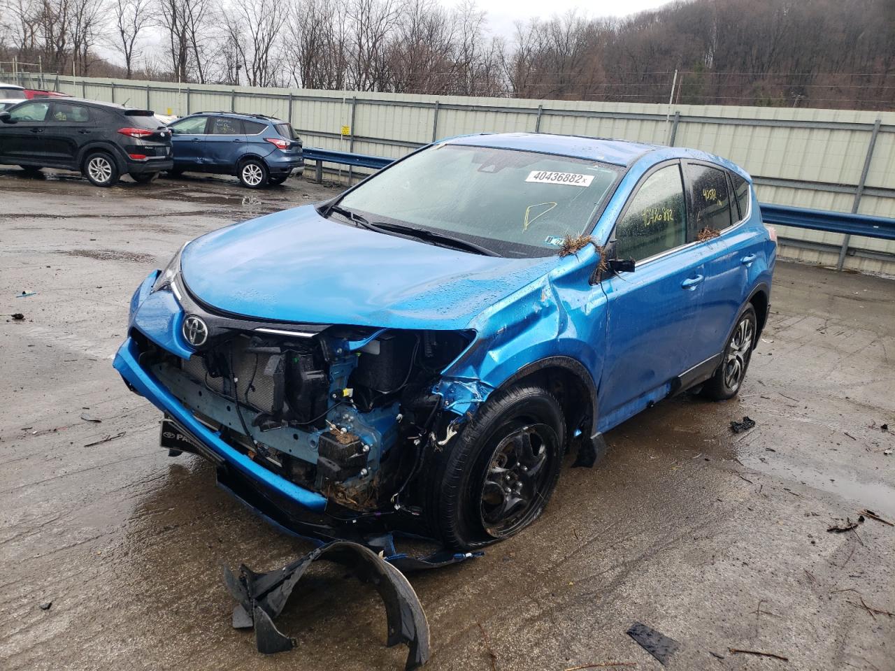 Photo 2 from auction – 2018 TOYOTA RAV4 LE with VIN JTMBFREV3JJ742811