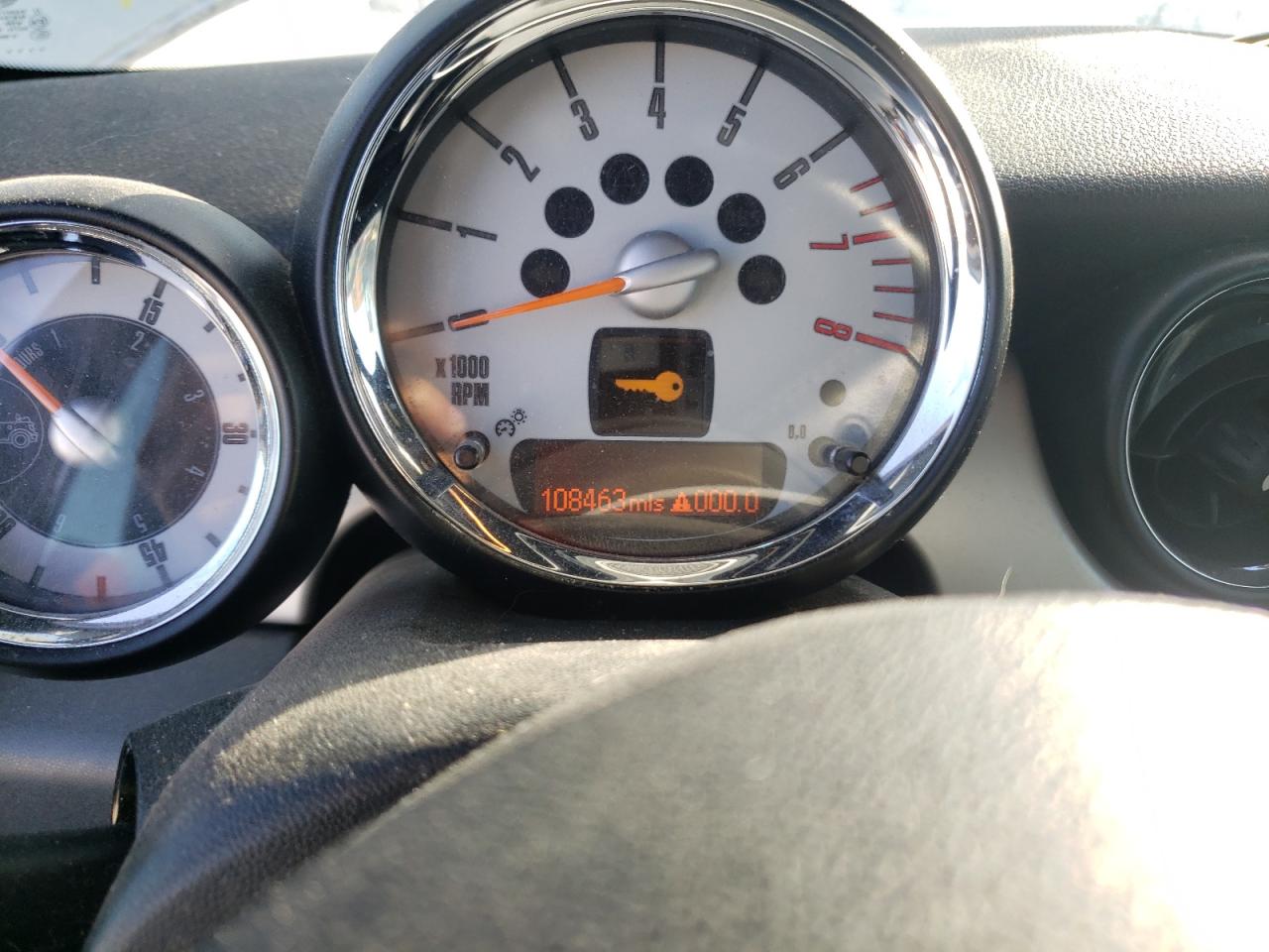 Photo 8 from auction – 2009 MINI COOPER with VIN WMWMR335X9TJ93704