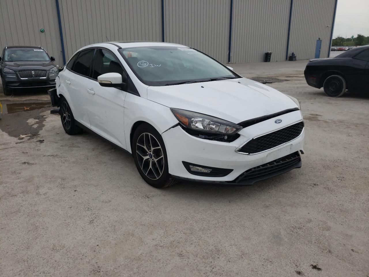 FORD FOCUS SEL 2017 with VIN 1FADP3H22HL322918 - Photo from auction