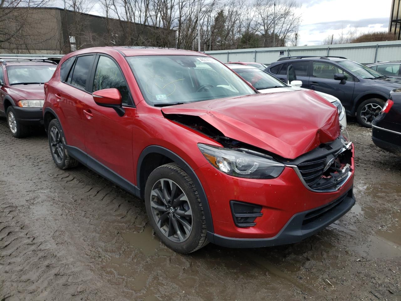 MAZDA CX-5 GT 2016 with VIN JM3KE4DY9G0670665 - Photo from auction