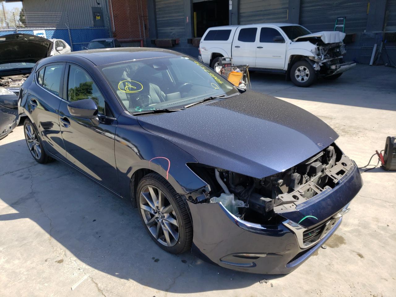 MAZDA 3 TOURING 2018 with VIN 3MZBN1L33JM265769 - Photo from auction