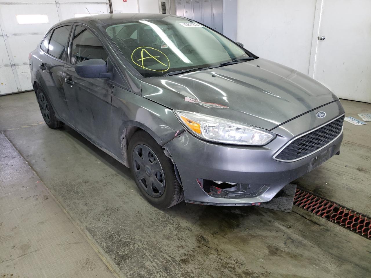 FORD FOCUS S 2015 with VIN 1FADP3E21FL281702 - Photo from auction