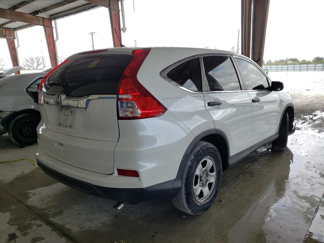 Photo 4 from auction – 2016 HONDA CR-V LX with VIN 5J6RM3H39GL026904