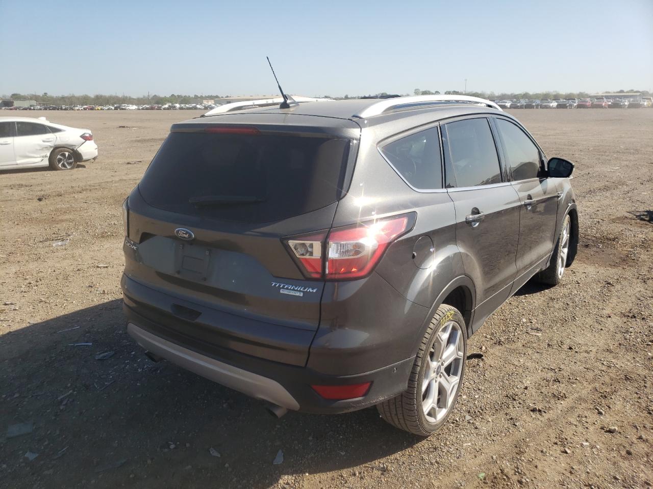 Photo 4 from auction – 2018 FORD ESCAPE TIT with VIN 1FMCU0J99JUB72192