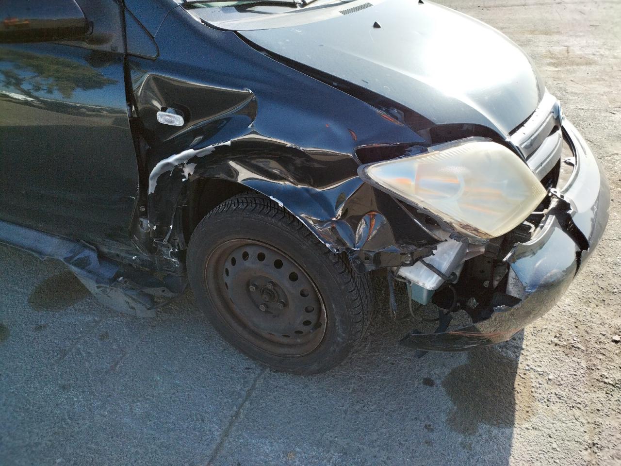 Photo 9 from auction – 2005 TOYOTA SCION XA with VIN JTKKT624750123412