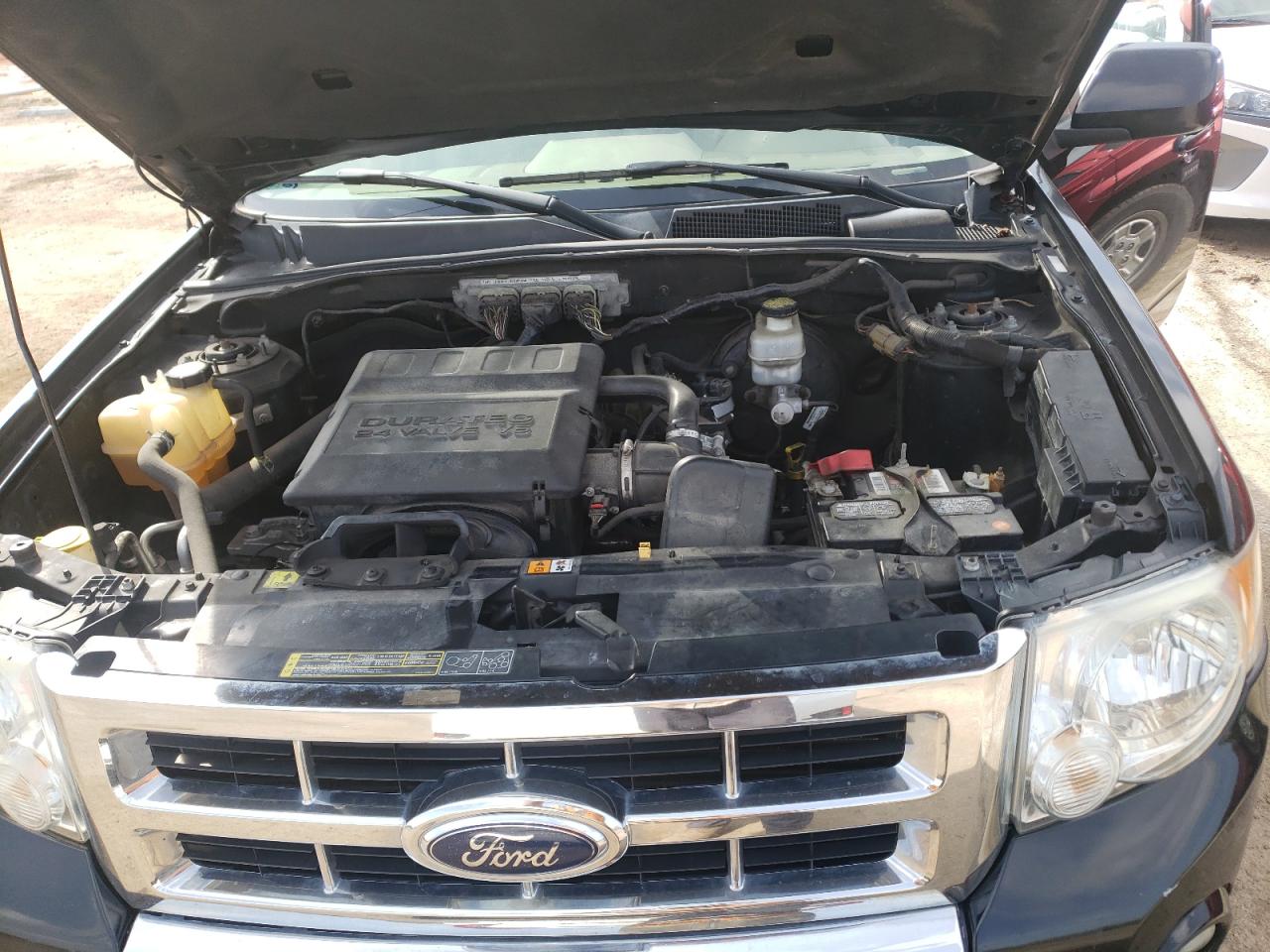 Photo 7 from auction – 2009 FORD ESCAPE LIM with VIN 1FMCU04G79KA35687