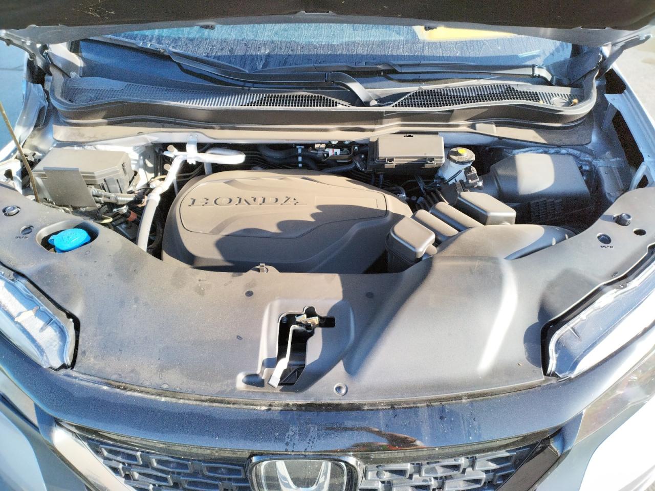 Photo 7 from auction – 2021 HONDA PASSPORT E with VIN 5FNYF8H54MB040539
