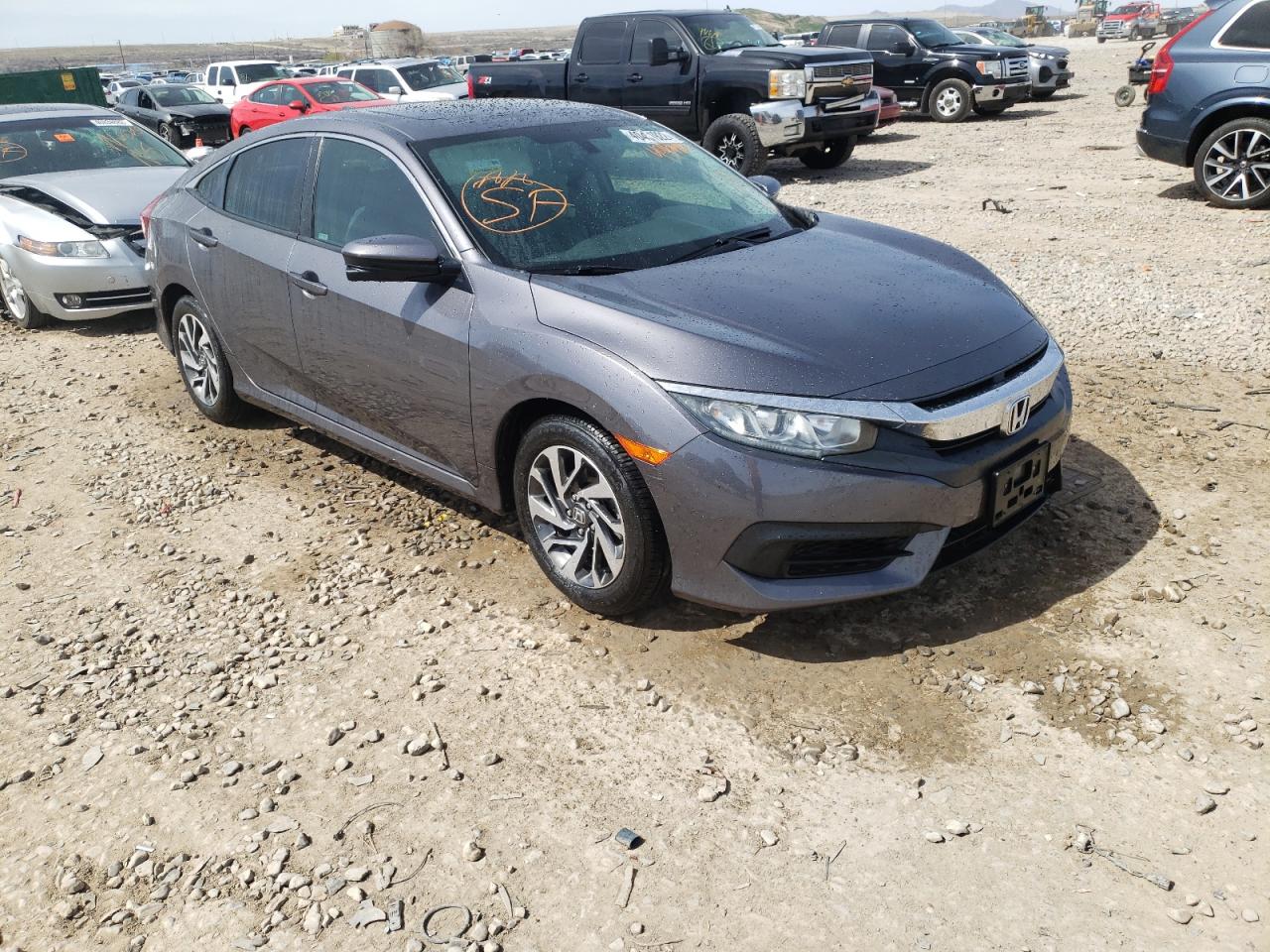 HONDA CIVIC EX 2018 with VIN 19XFC2F7XJE004048 - Photo from auction