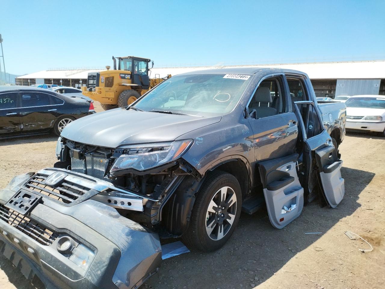 Photo 2 from auction – 2020 HONDA RIDGELINE with VIN 5FPYK3F54LB029953