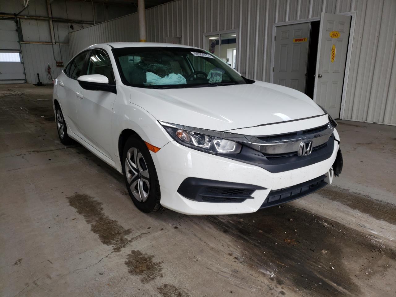 HONDA CIVIC LX 2018 with VIN 19XFC2F57JE039287 - Photo from auction