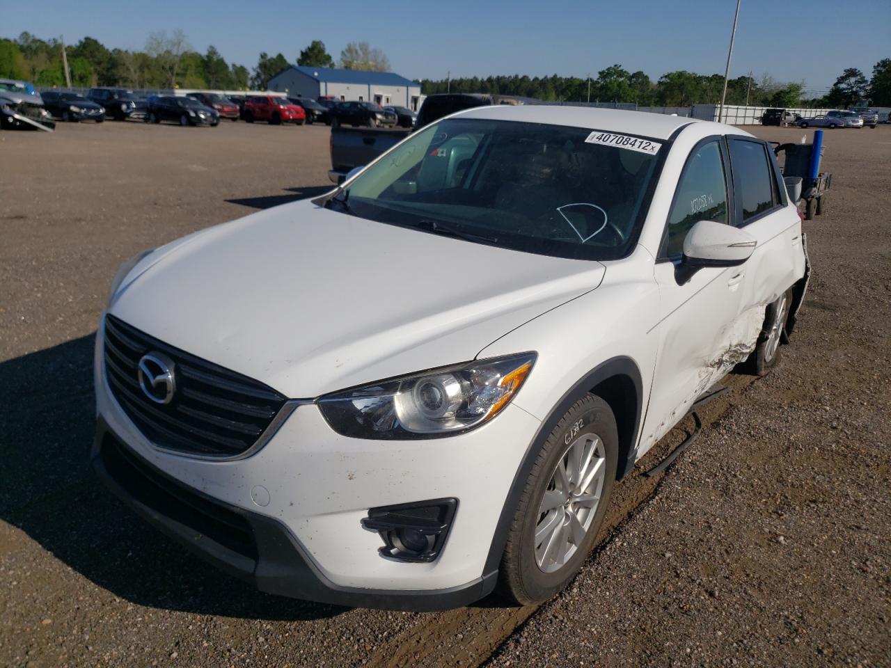 Photo 2 from auction – 2016 MAZDA CX-5 TOURI with VIN JM3KE2CY3G0799877