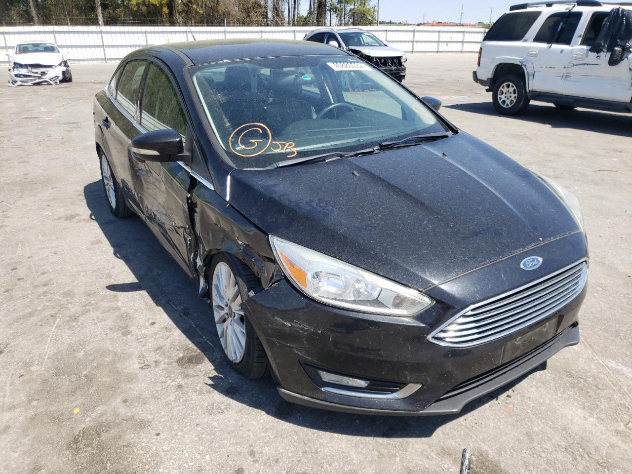 FORD FOCUS TITA 2015 with VIN 1FADP3J22FL228626 - Photo from auction
