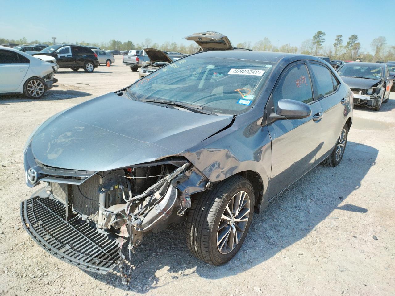 Photo 2 from auction – 2016 TOYOTA COROLLA L with VIN 5YFBURHE7GP372212